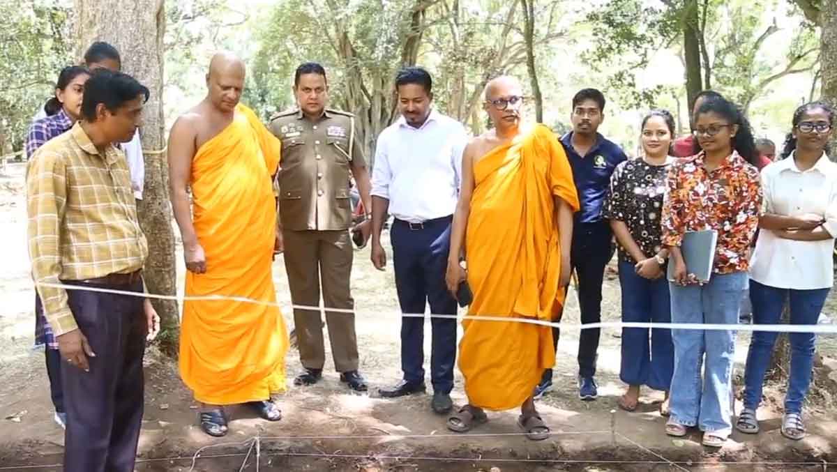 IMPORTANT FIND : Archaology Professor Chandana Rohana Withanachchi with monks and other observer at the dig in the Abhayagiri complex